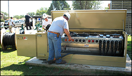 two men installing an s and c vista switchgear opens a case study about University Implements Smart Grid System to Minimize Power Outages featuring self healing grid in Portales New Mexico University